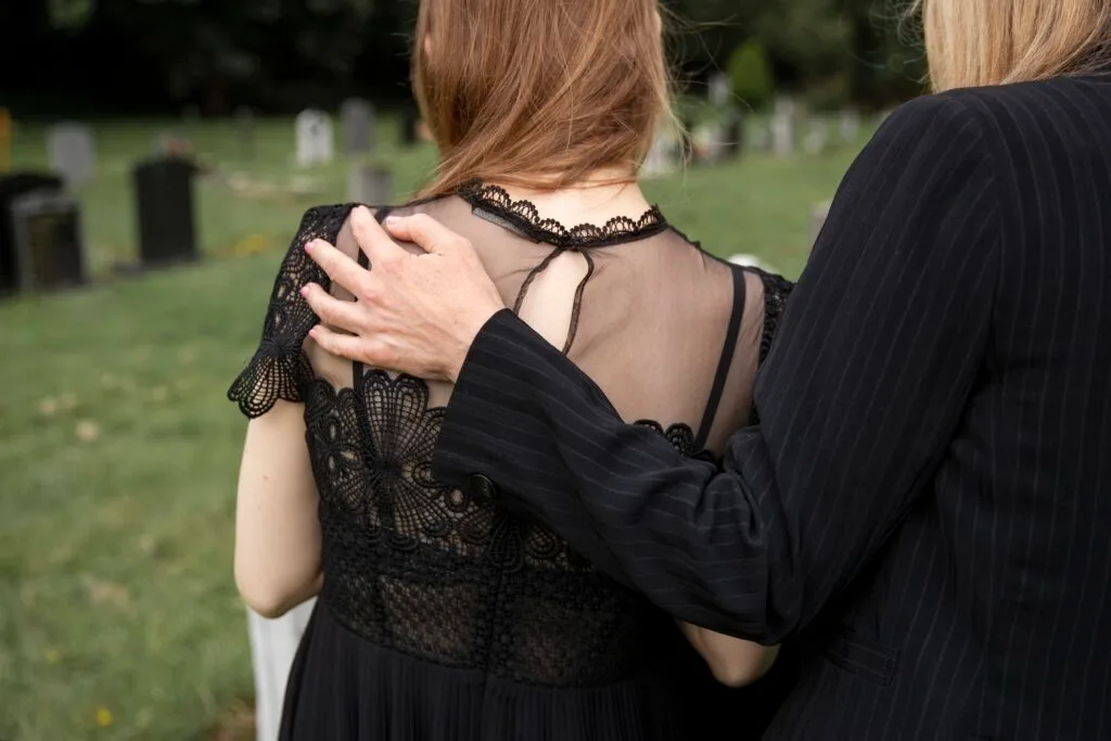 family-visiting-grave-loved-one